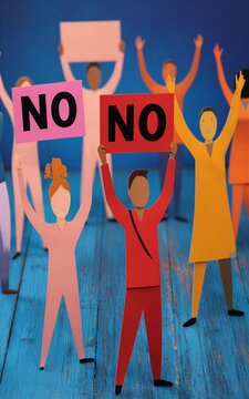 Paper cutouts protest with "NO" signs unified in dissent against a