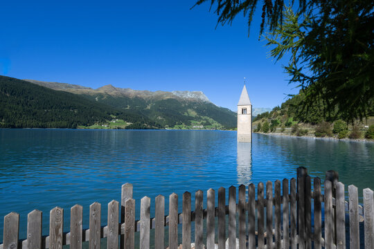 Reschen See - Reschen Lake - Lago di Resia - Tower of the sunken village of Graun. South Tirol, Alto Adige, Italy