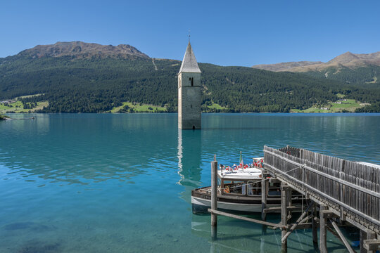 Reschen See - Reschen Lake - Lago di Resia - Tower of the sunken village of Graun. South Tirol, Alto Adige, Italy