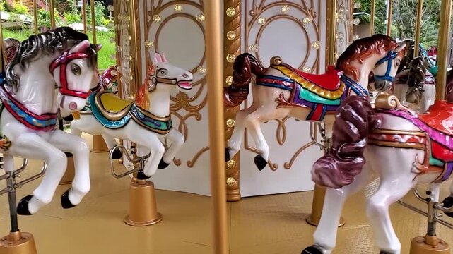 A colorful carousel spinning. Close-up