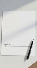 Naklejka premium Blank document with signature line and black pen on white desk surface. concept of office supplies, professional paperwork, business signing.