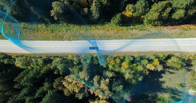 Dark van entering left, traveling across rural road with blue-green waves over vehicle for mapping