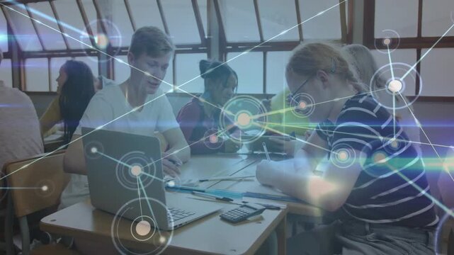 Vertical video: Study group collaborating, network appearing and linking laptop, aiding education