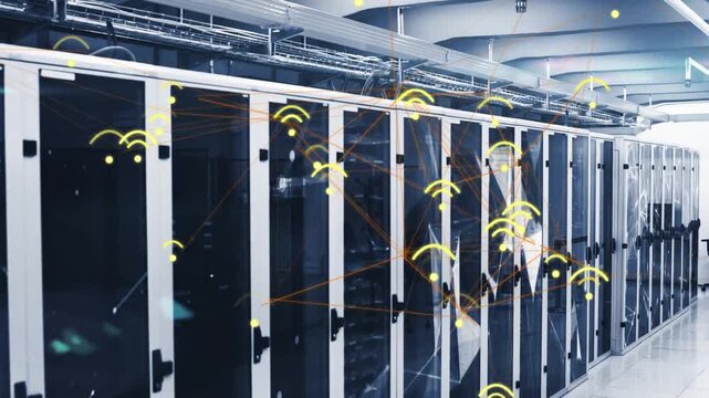 Net monitor detecting spike, firing wireless nodes over data racks for analysis, IT lead gesturing