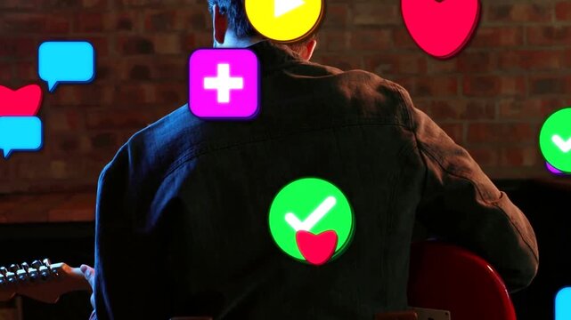 Rear-view musician playing red guitar while animated icons emerging and obscuring him for music PR