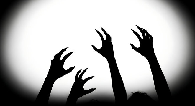 Spooky silhouetted clawed hands reaching up from darkness - mysterious horror halloween concept