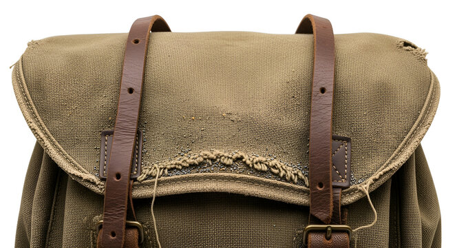 Close-up of khaki canvas rucksack flap with aged leather straps featuring frayed edges and weathered texture for outdoor travel