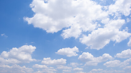 Obraz premium clear blue sky background,clouds with background, Blue sky background with tiny clouds. White fluffy clouds in the blue sky. 