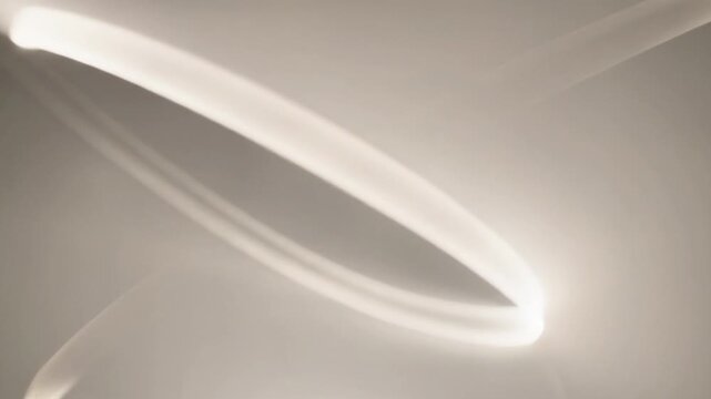 A grayscale background with intersecting curved lines in varying shades of gray