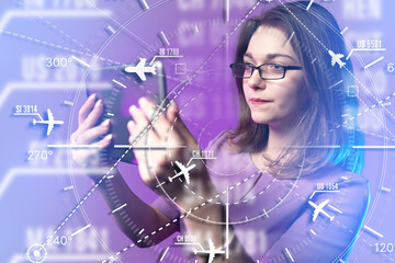 Air traffic control, aviation monitoring. Female dispatcher analyzes flight routes on digital interface, managing aircraft navigation and airspace coordination. © Grispb
