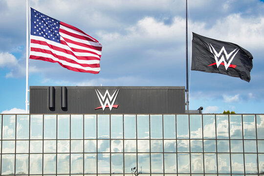 The World Wrestling Entertainment, WWE, logo on a flag flying at the headquarters in Stamford, CT  USA on April 16, 2020.