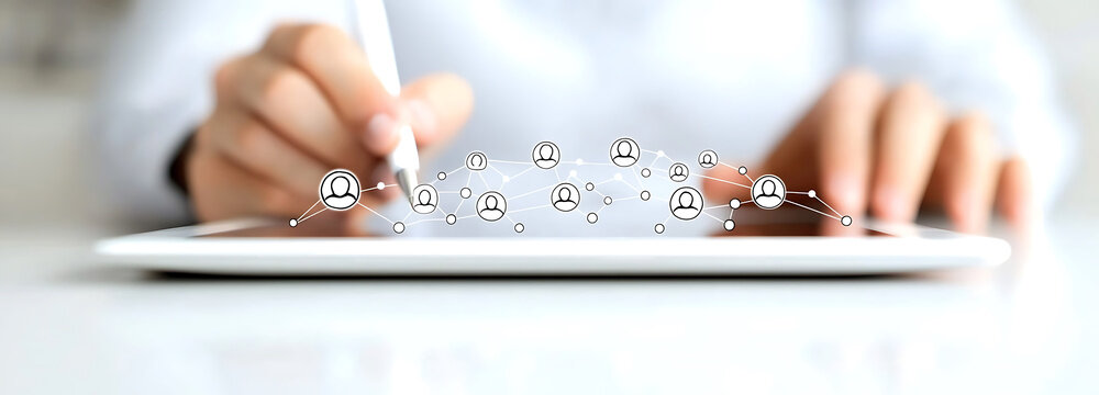 Businessman using tablet computer to connect with digital network and draw ideas creatively