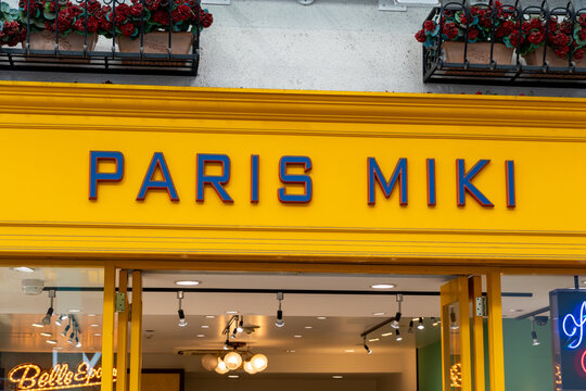 MUSASHINO, TOKYO, JAPAN - MARCH 24, 2026: The distinctive yellow branding sign of Paris Miki, a leading Japanese eyewear and optical retailer, in Musashino, Tokyo.