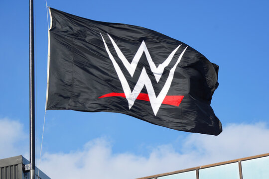The World Wrestling Entertainment, WWE, logo on a flag flying at the headquarters in Stamford, CT  USA on April 16, 2020.