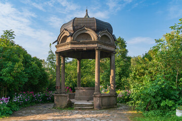 Kivoriy (canopy over the spring of water) in the St. George (Yuriev) on a sunny summer day, Veliky Novgorod, Russia © Ula Ulachka