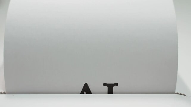 Word AI typed in bold black letters on white paper close-up