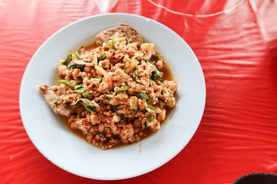 Larb Moo is a popular and easy-to-make Northeastern Thai dish that's spicy, flavorful, and well-balanced. It's made by stir-frying minced pork until cooked, then seasoning it with fish sauce, lime jui