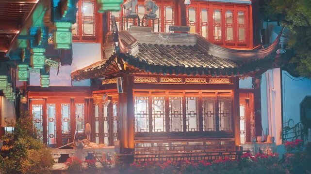 Lit traditional pavilion with lanterns, warm interior glow and timber veranda framing illuminated windows courtyard garden and tiled roof create inviting festival atmosphere for teahouse hospitality