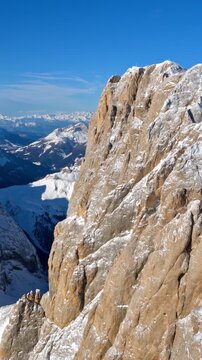 Stunning dolomites panorama with clear sky, a breathtaking aerial view of marmolada mountain range.