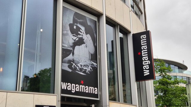 London UK 02.07.2025 wagamama restaurant exterior with modern urban architecture and brand signage on building facade in busy city environment