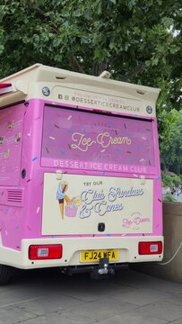 London UK 02.07.2025 colorful dessert ice cream truck parked near park with playful branding and street food concept in lively urban summer atmosphere