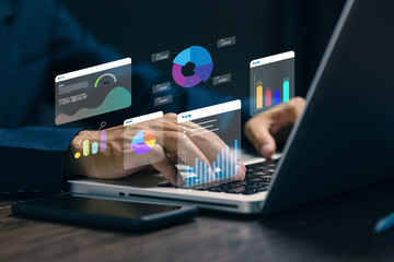Fototapeta premium Digital data analytics dashboard on laptop showing charts and graphs, representing business intelligence, big data analysis, reporting system and performance monitoring.