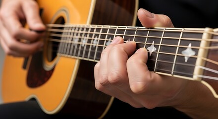 Fototapeta premium Close-up view of guitarist playing acoustic guitar stringed melody