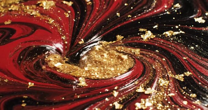 A vibrant swirling pattern of red, black, and gold with glittering stars, creating a mesmerizing abstract design