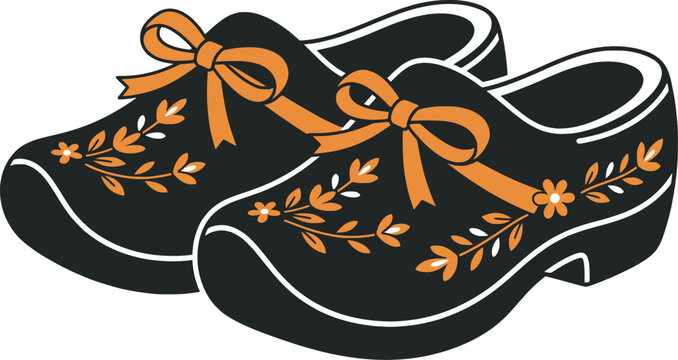 Dutch wooden clogs with orange ribbons and blooming flowers
