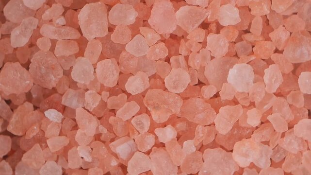 Close-up of pink salt in various shapes and sizes