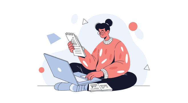 Young woman with bun hairstyle working on laptop with notebook and papers
