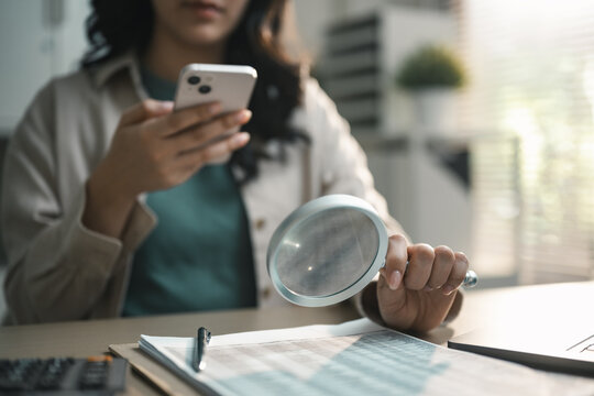 User scanning receipt with smartphone and magnifying glass, illustrating OCR technology for expense tracking, document management and digital finance automation.