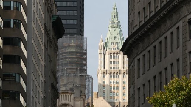 New York City Woolworth building 1913, skyscraper on Broadway in Downtown Financial District, Lower Manhattan, United States of America. Gothic historic architecture, green cooper roof, Battery park.