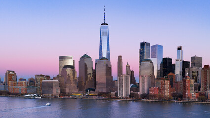Obraz premium New York panoramic skyline at dusk. NYC panorama dusk metropolis skyline. New York big American City panoramic. New York City panoramic at dusk. New York City panoramic at dusk.