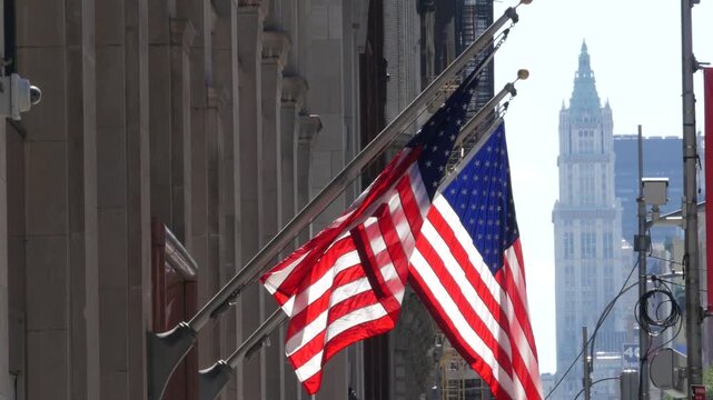 New York City Woolworth building 1913, skyscraper on Broadway in Downtown Financial District, Lower Manhattan, United States of America. Gothic historic architecture, cooper roof, USA american flag.
