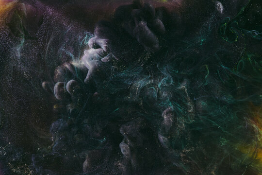 Luxurious abstract dark background. Explosive colors wallpaper, outer space pattern. Dynamic paint backdrop.