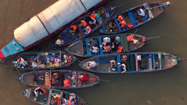 Aerial view of Cai Rang floating market, Can Tho, Vietnam. It is famous market in Mekong Delta, Vietnam. Tourists have breakfast on a boats, buy and sell food, vegetable, fruits on boat, ship