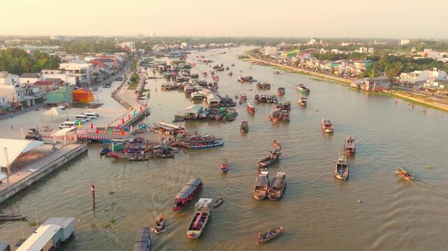 Aerial view of Cai Rang floating market, Can Tho, Vietnam. It is famous market in Mekong Delta, Vietnam. Tourists have breakfast on a boats, buy and sell food, vegetable, fruits on boat, ship