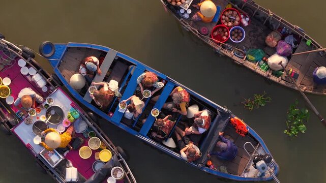 Aerial view of Cai Rang floating market, Can Tho, Vietnam. It is famous market in Mekong Delta, Vietnam. Tourists have breakfast on a boats, buy and sell food, vegetable, fruits on boat, ship