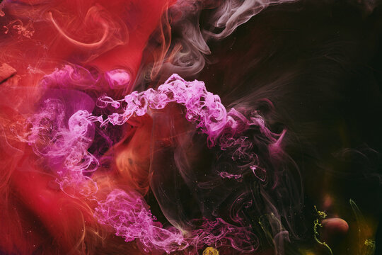 Abstract colorful red black background. Moving flow of paints, fluid liquid art, space sky