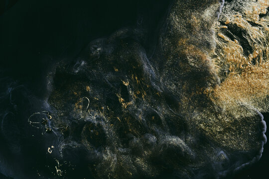 Luxurious abstract dark background. Explosive colors wallpaper, outer space pattern. Dynamic paint backdrop.