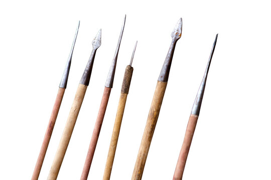 Collection of antique wooden spears with metal tips. Ancient hunting weapons and historical military equipment. Traditional tools for fishing or combat isolated on transparent background.