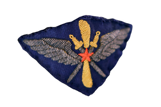 Military patch with winged dagger and star symbol on dark blue fabric USSR. Embroidered insignia for special force or air commando unit. Isolated symbol on transparent background for design.