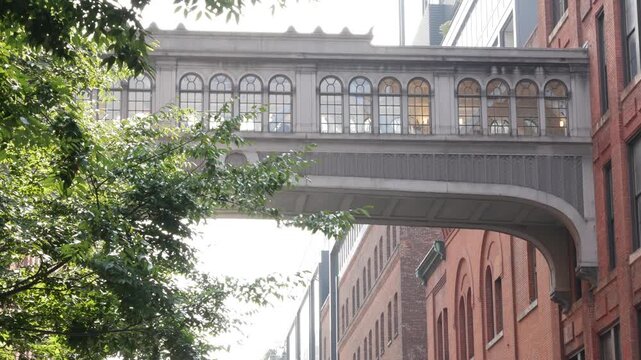 New York City Manhattan Midtown Meatpacking district skybridge in Chelsea, market from High Line Park, United States of America. Old historic bridge, elevated walkway. Industrial factory architecture.