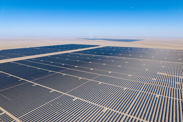 Vast solar farm stretches across the desert landscape in Jiayuguan City, China © AS_SleepingPanda
