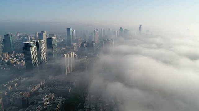 Aerial Tel Aviv skyline fog rolling over city Israel

Drone footage Tel Aviv skyscrapers covered in fog urban skyline Israel March 25 2026

