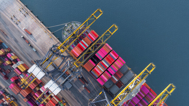 Aerial view Container cargo ship loading unloading container import export sea port, Global trade business container cargo ship freight shipping commercial trade logistic transportation international.