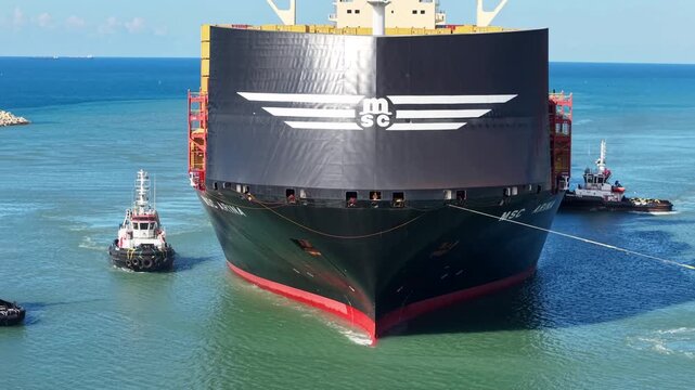 Aerial MSC container ship docking Haifa port cranes Israel

Drone footage MSC cargo ship maneuvering with tugboats Haifa port cranes Israel February 25 2026
