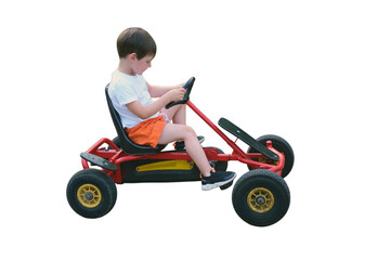 Little boy riding red pedal go-kart isolated on transparent background. Young child having fun...