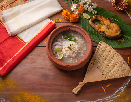 Traditional bengali meal with panta bhat, fried fish & sari